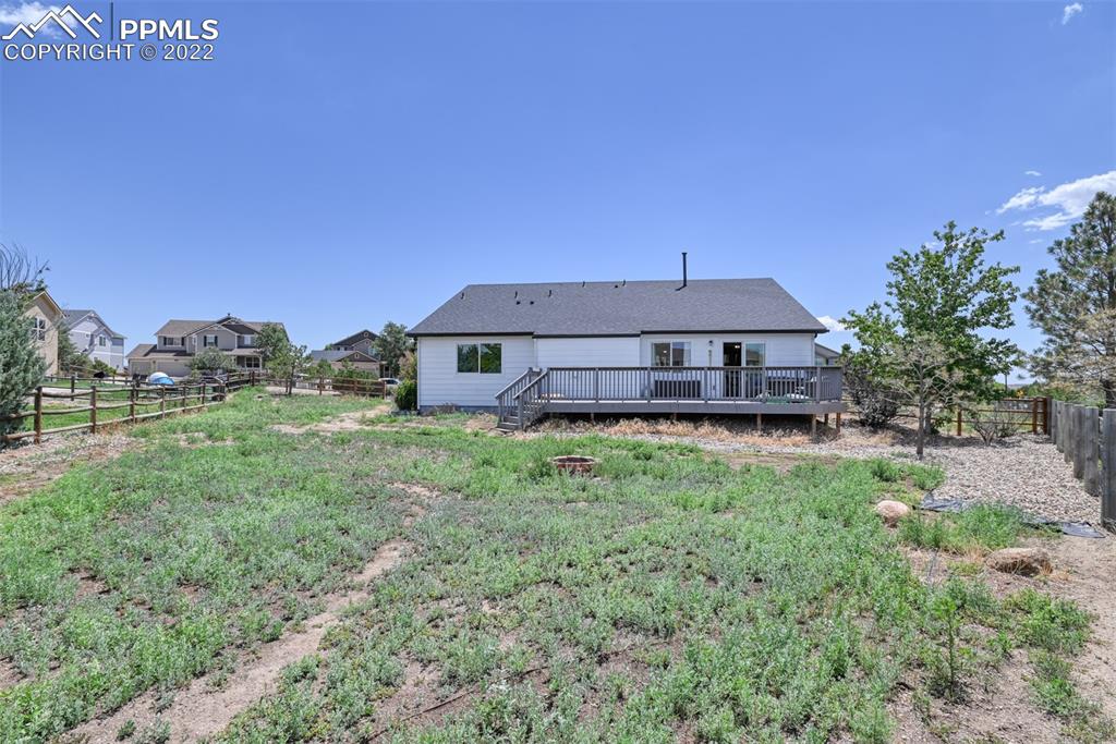 8820 Oakmont Road Peyton, CO 80831 - Photo 8 of 50 a front view of a house with a yard