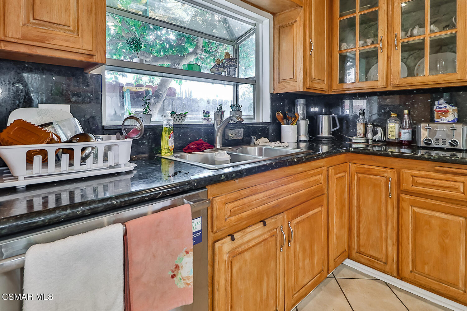 3964 Celia Court Simi Valley, CA 93063 - Photo 13 of 38 a kitchen with stainless steel appliances granite countertop a sink and cabinets