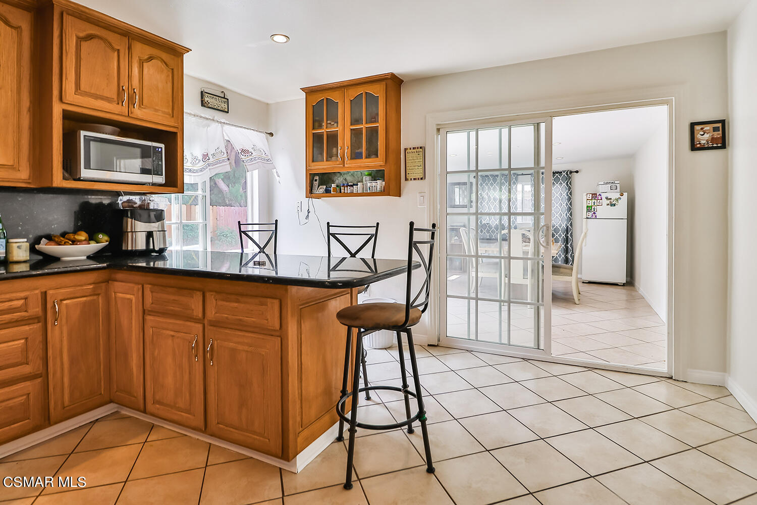 3964 Celia Court Simi Valley, CA 93063 - Photo 15 of 38 a kitchen with stainless steel appliances granite countertop a stove a sink and a refrigerator