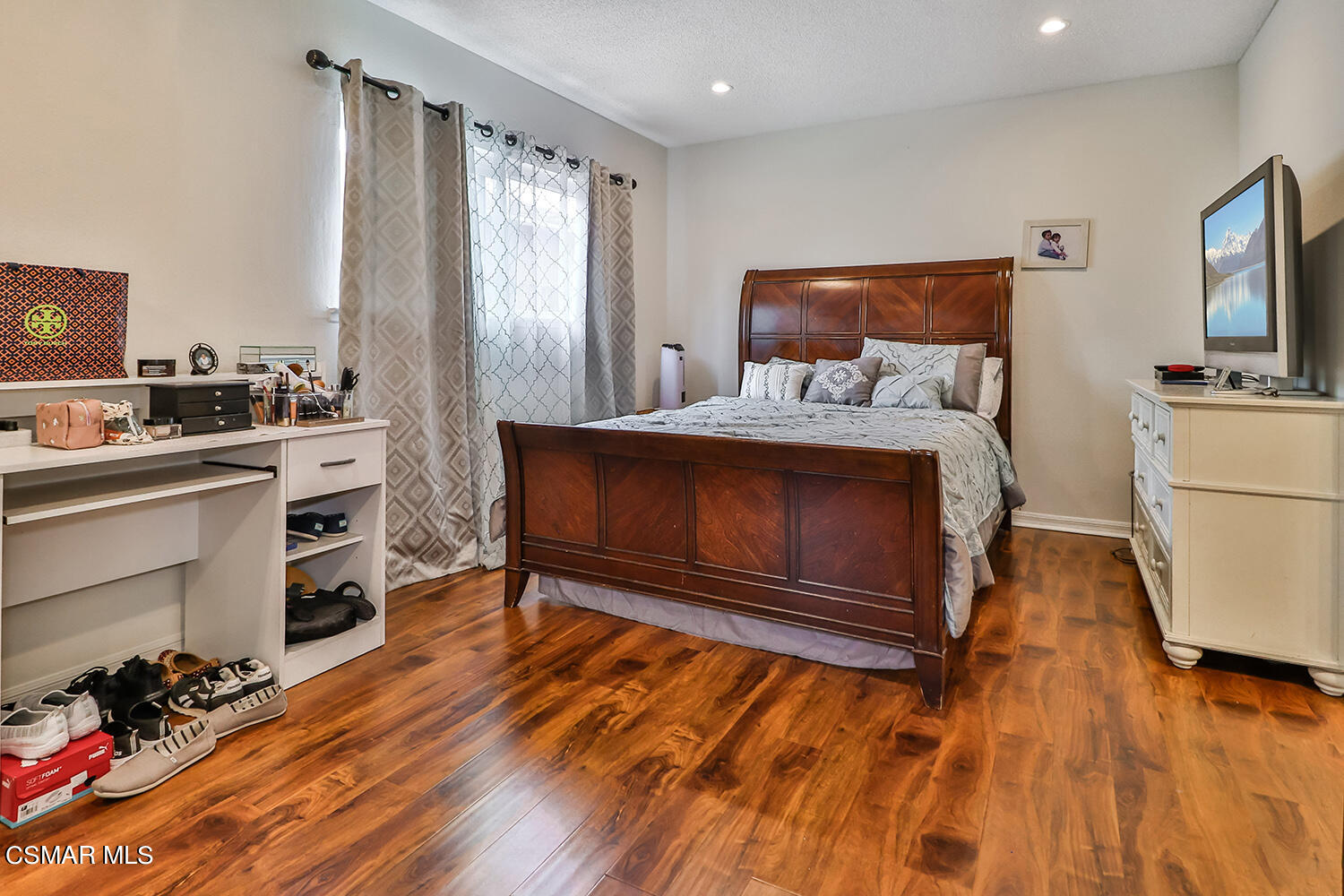 3964 Celia Court Simi Valley, CA 93063 - Photo 20 of 38 a living room with a bed furniture and a flat screen tv