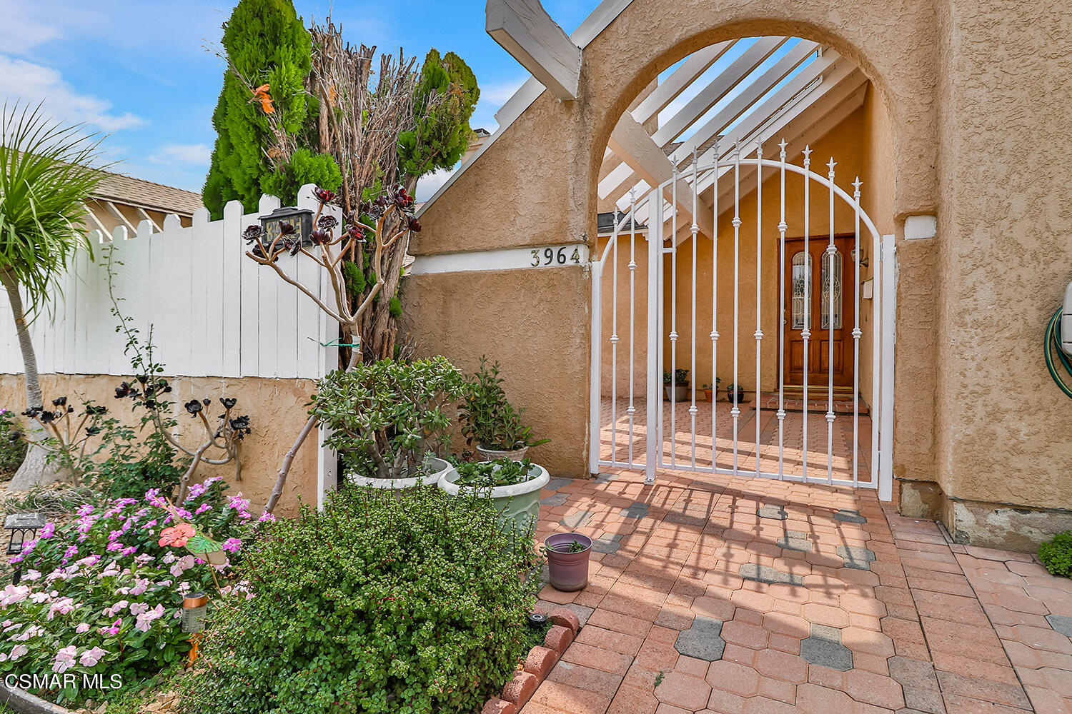 3964 Celia Court Simi Valley, CA 93063 - Photo 2 of 38 a view of a house with a flower garden