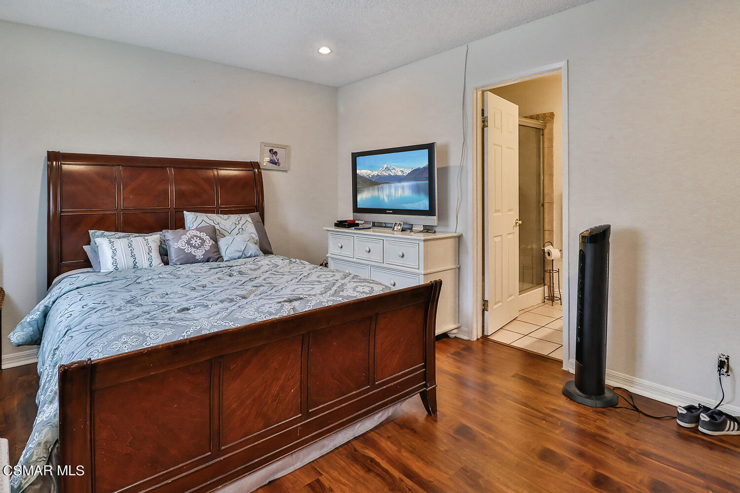 3964 Celia Court Simi Valley, CA 93063 - Photo 22 of 38 a bedroom with a bed and flat tv screen on dresser