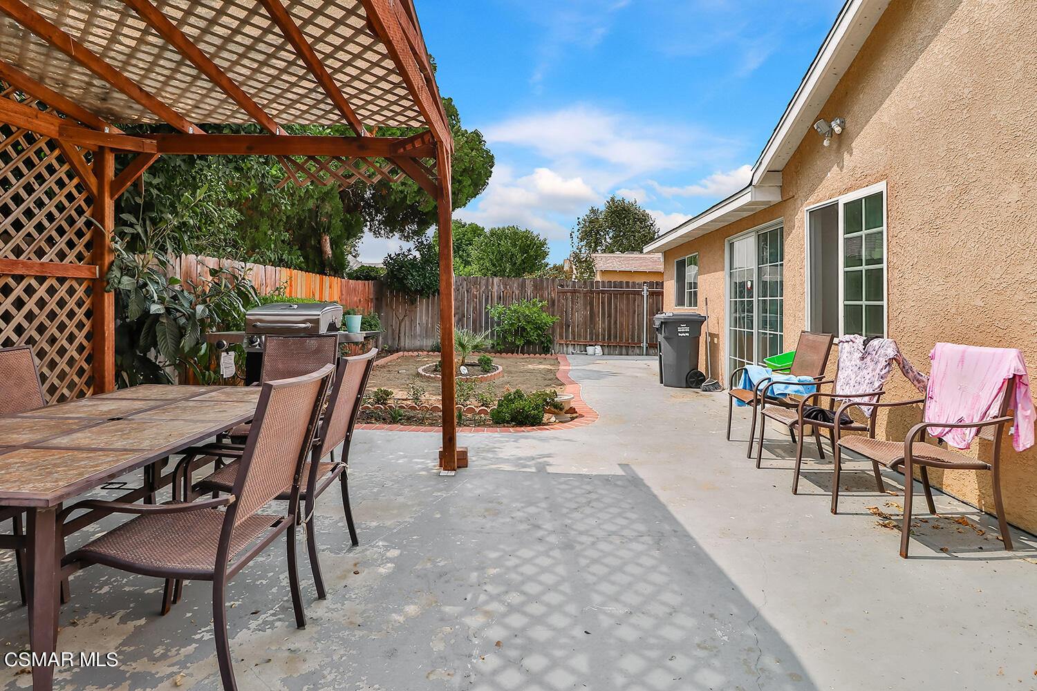 3964 Celia Court Simi Valley, CA 93063 - Photo 34 of 38 a view of a patio with table and chairs and potted plants