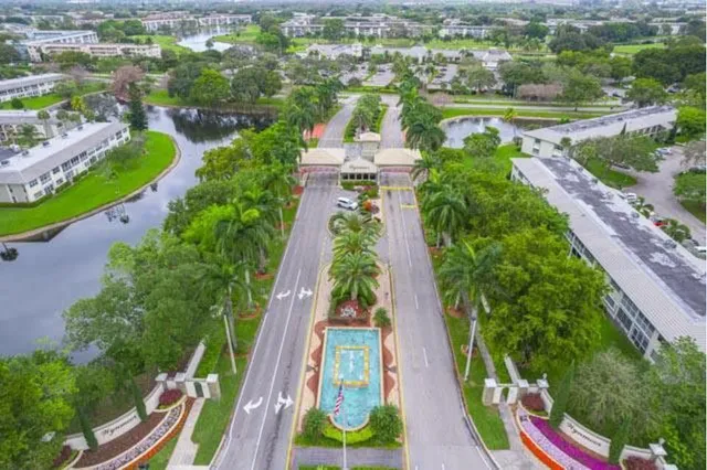 an aerial view of residential houses with outdoor space and street view