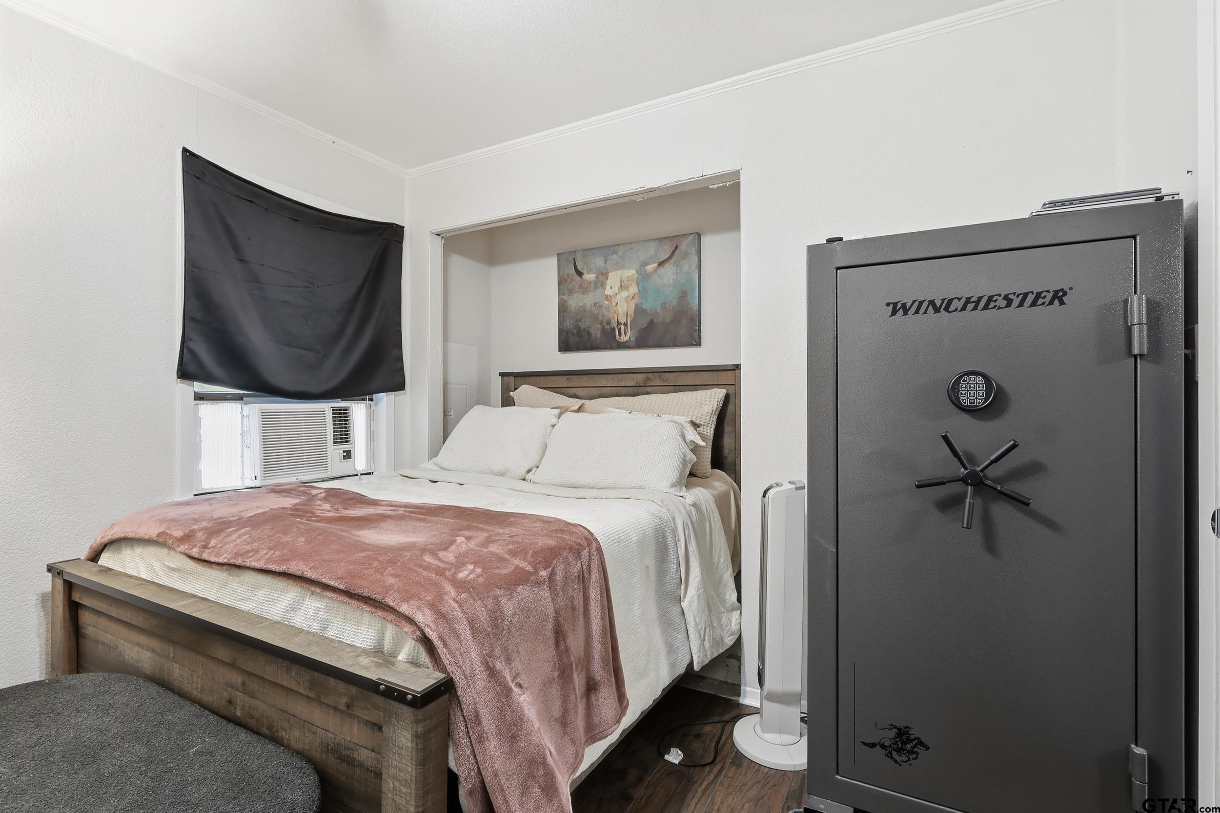 1775 County Road 1342 Pittsburg, TX 75686 - Photo 16 of 35 a bedroom with a bed and a flat screen tv