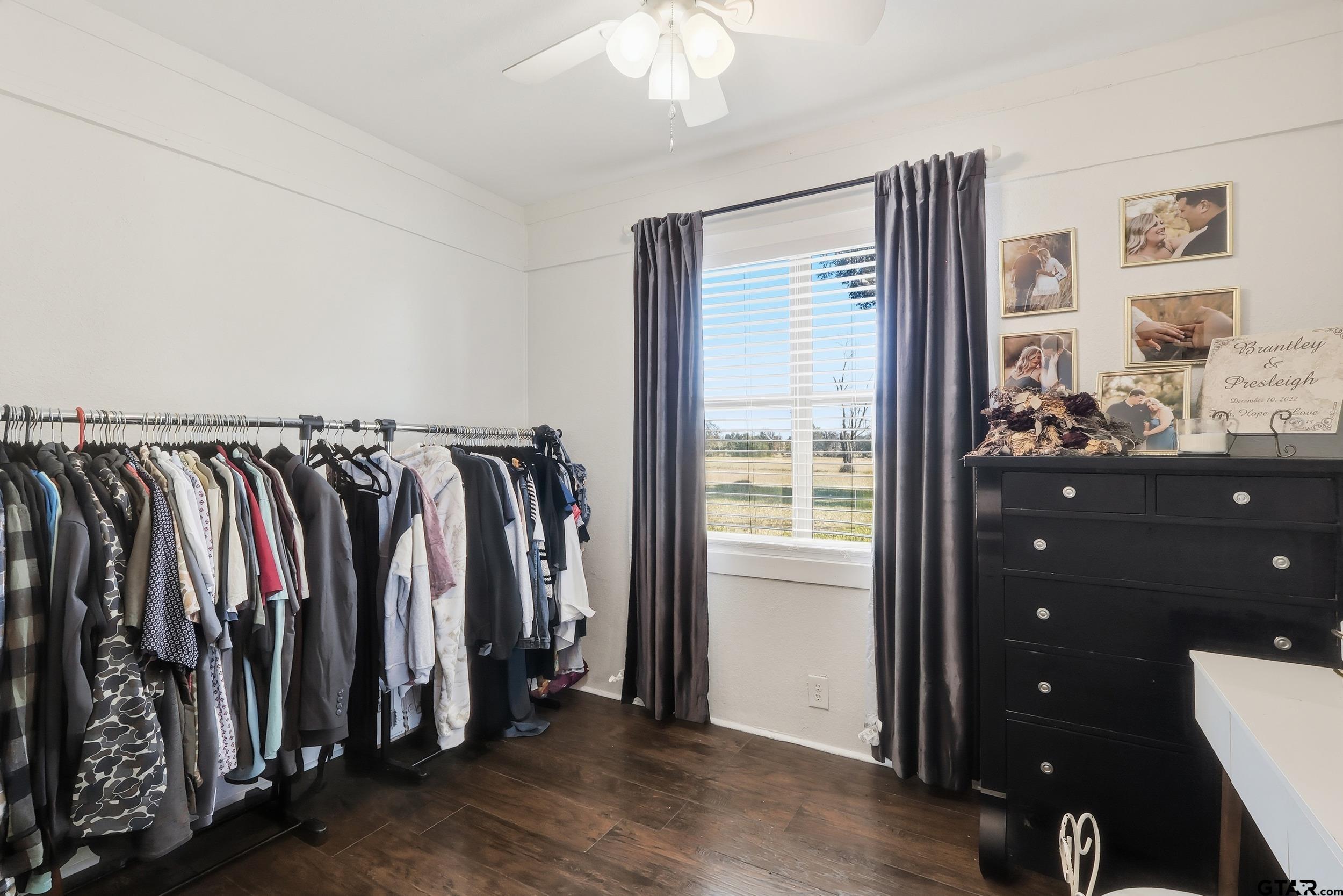 1775 County Road 1342 Pittsburg, TX 75686 - Photo 17 of 35 a view of walk in closet with clothes and shoes