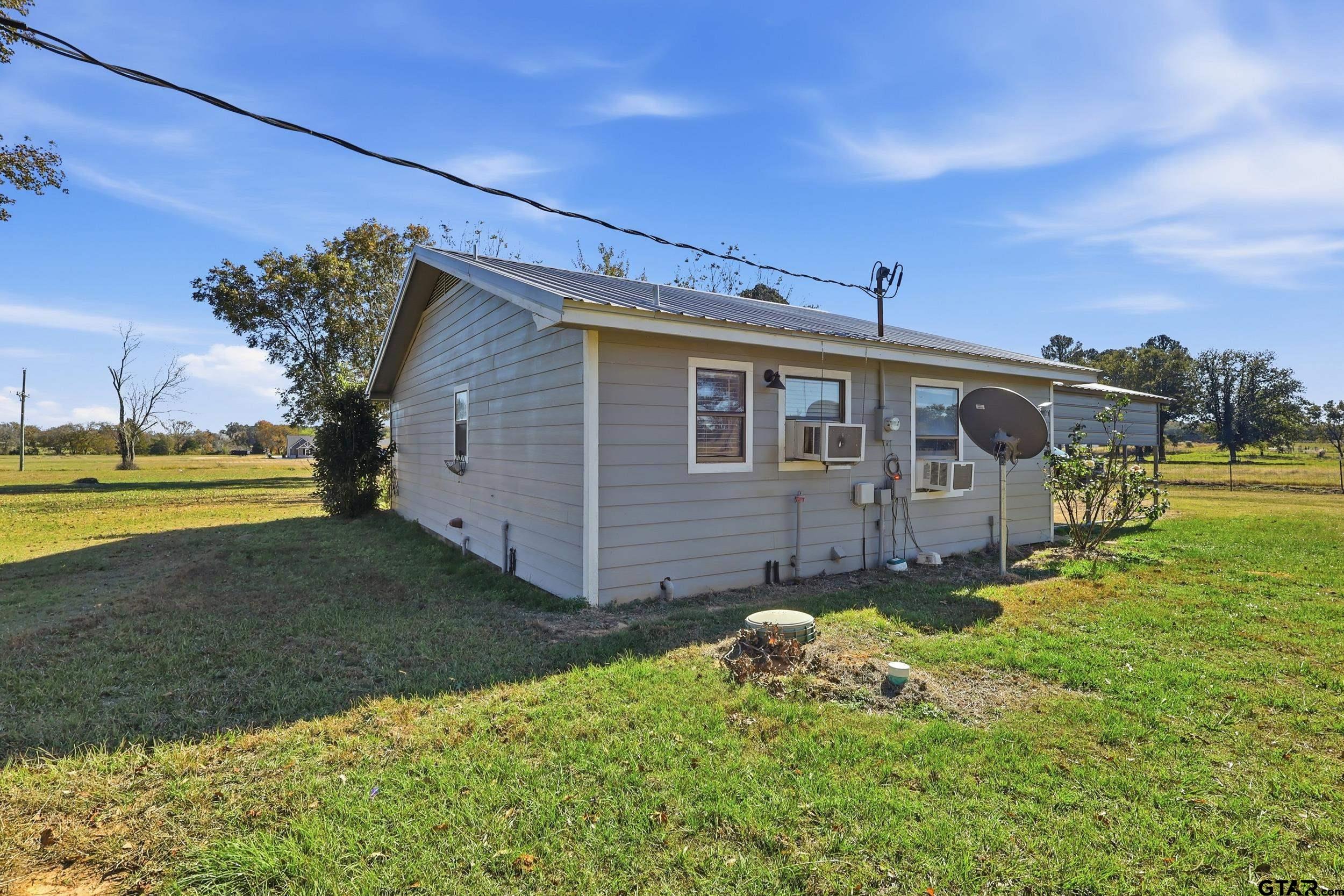 1775 County Road 1342 Pittsburg, TX 75686 - Photo 18 of 35 a view of a house with a big yard
