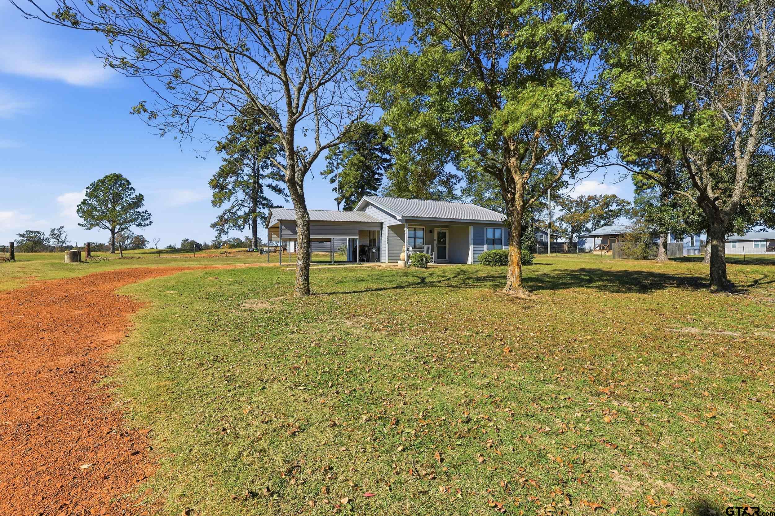 1775 County Road 1342 Pittsburg, TX 75686 - Photo 22 of 35 a view of a house with garden and trees