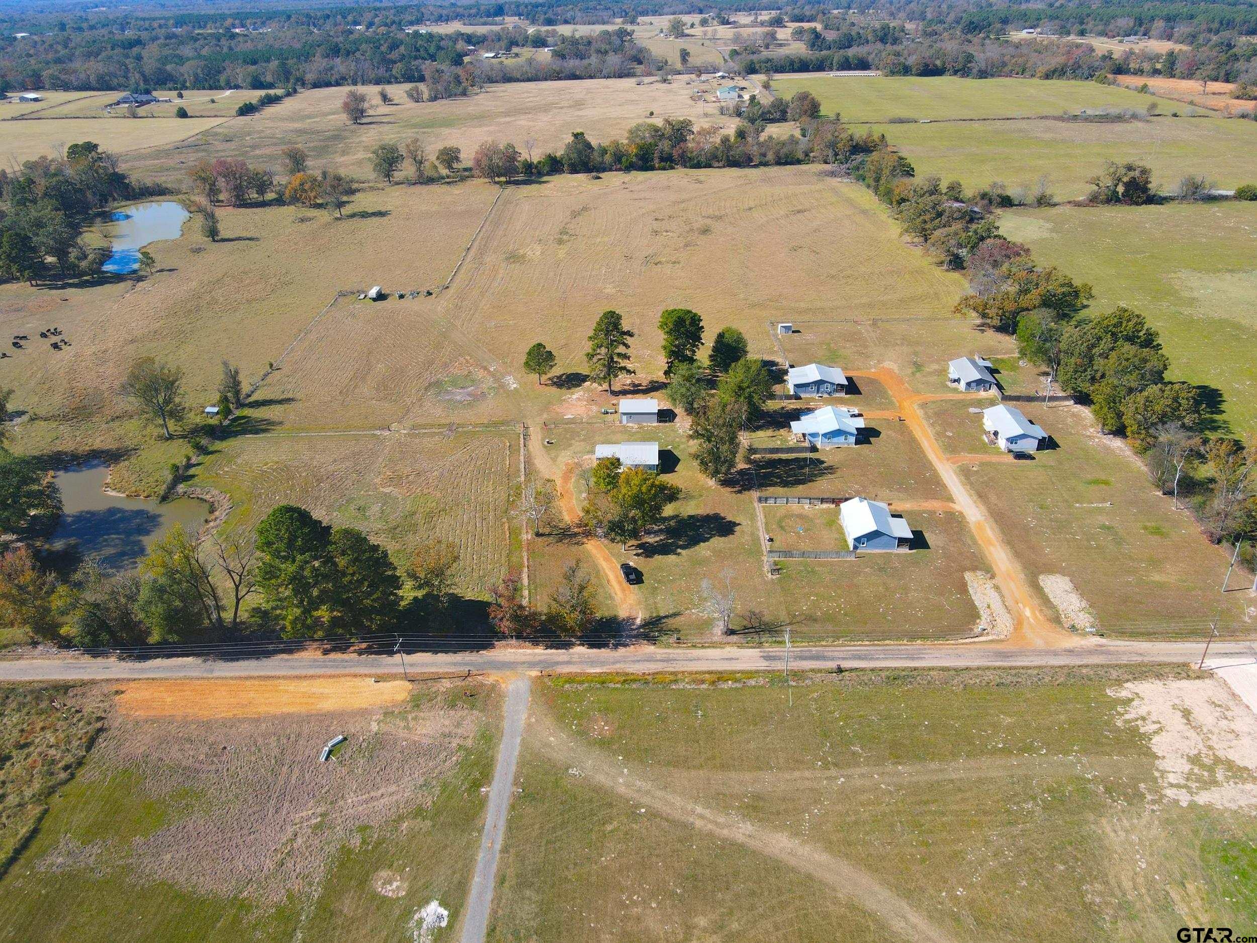 1775 County Road 1342 Pittsburg, TX 75686 - Photo 28 of 35 an aerial view of beach and residential houses with outdoor space