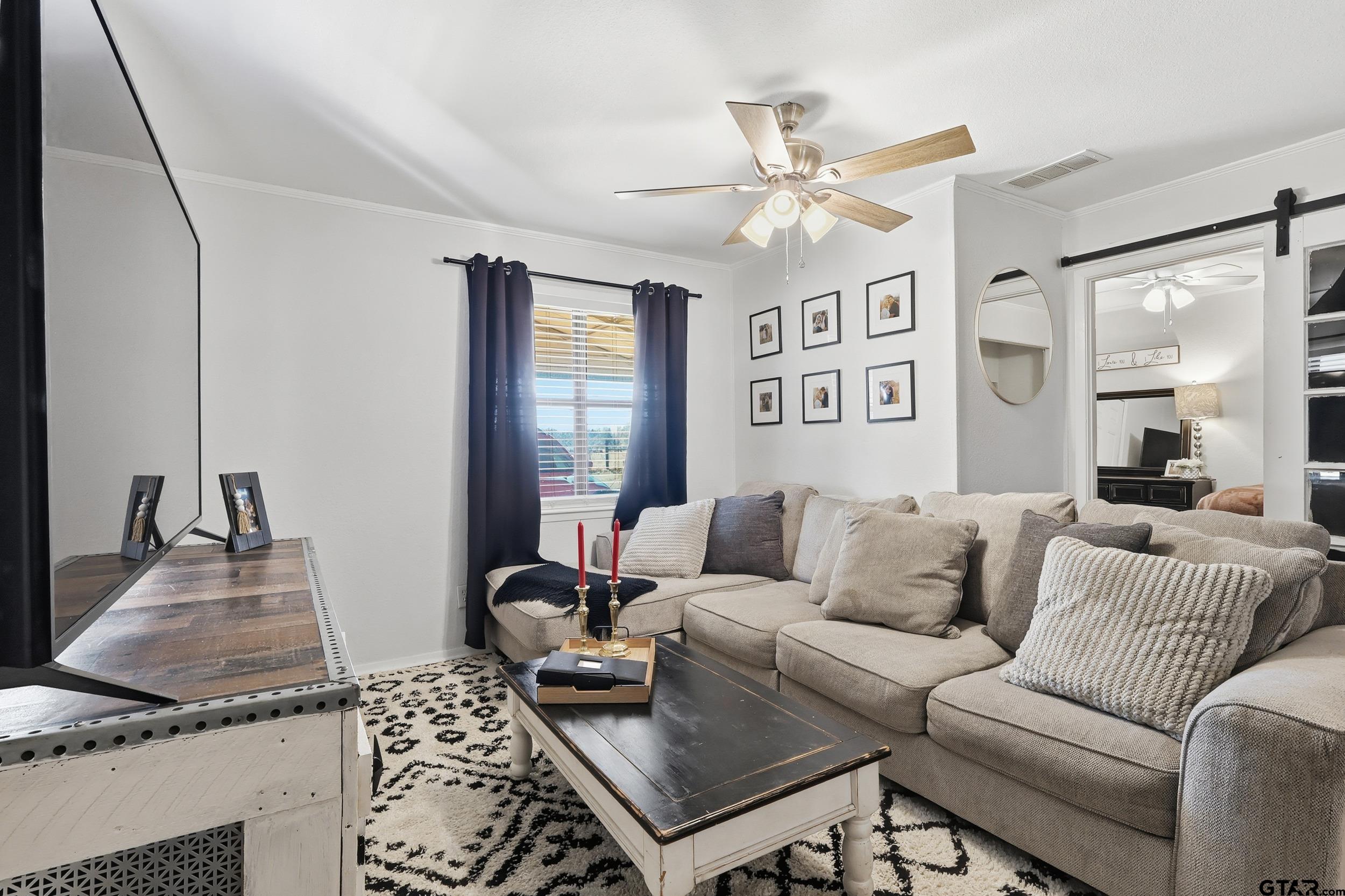 1775 County Road 1342 Pittsburg, TX 75686 - Photo 4 of 35 a living room with furniture and wooden floor