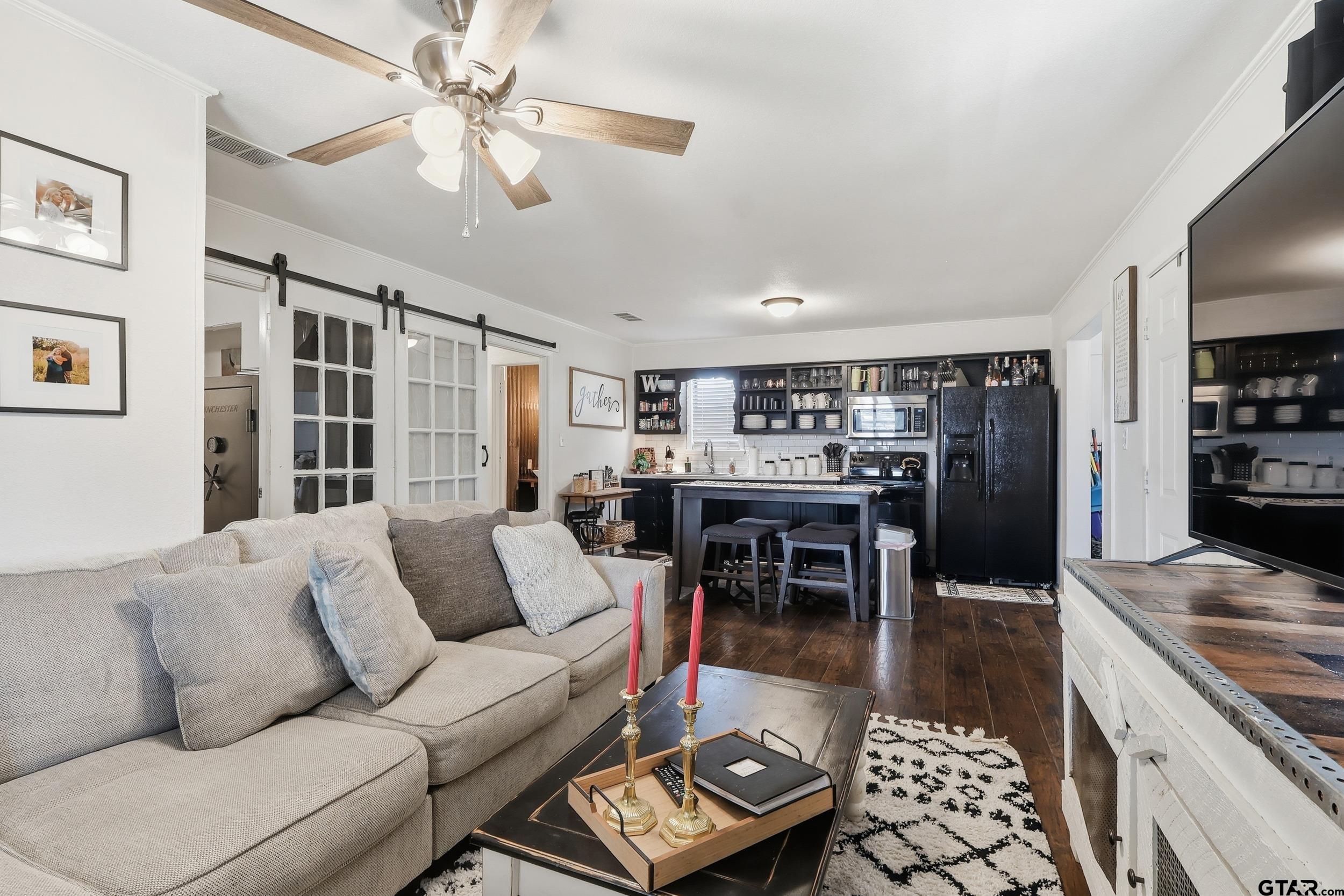 1775 County Road 1342 Pittsburg, TX 75686 - Photo 6 of 35 a living room with furniture and kitchen view