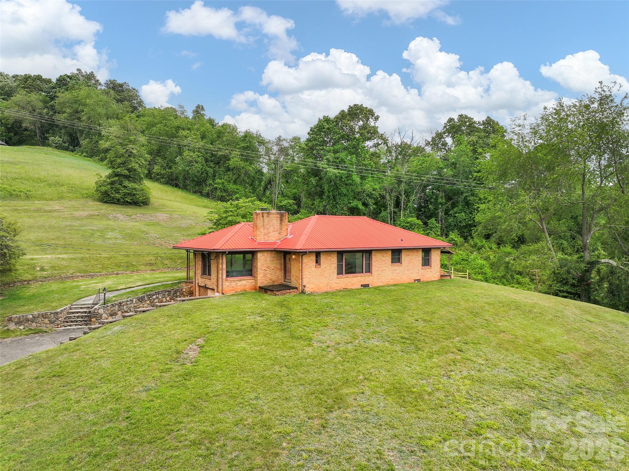 21 Beaverdam Road Canton, NC 28716 - Photo 2 of 24 a view of a house with a yard and sitting area