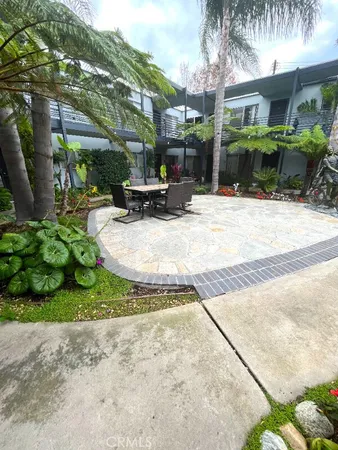 a view of yard with an outdoor seating
