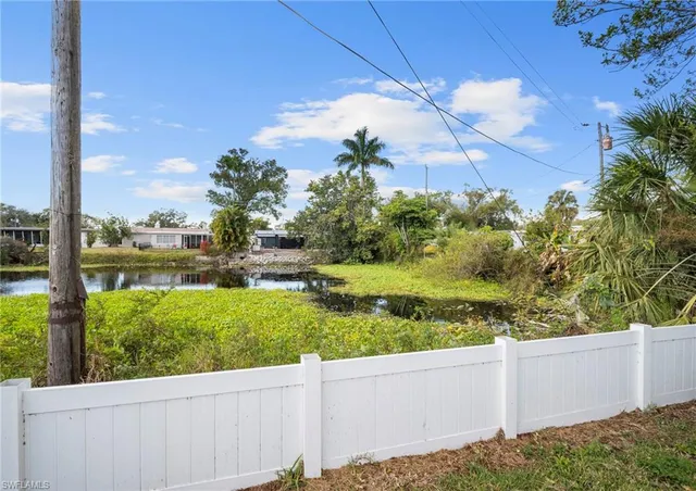 a view of a garden with lawn chairs
