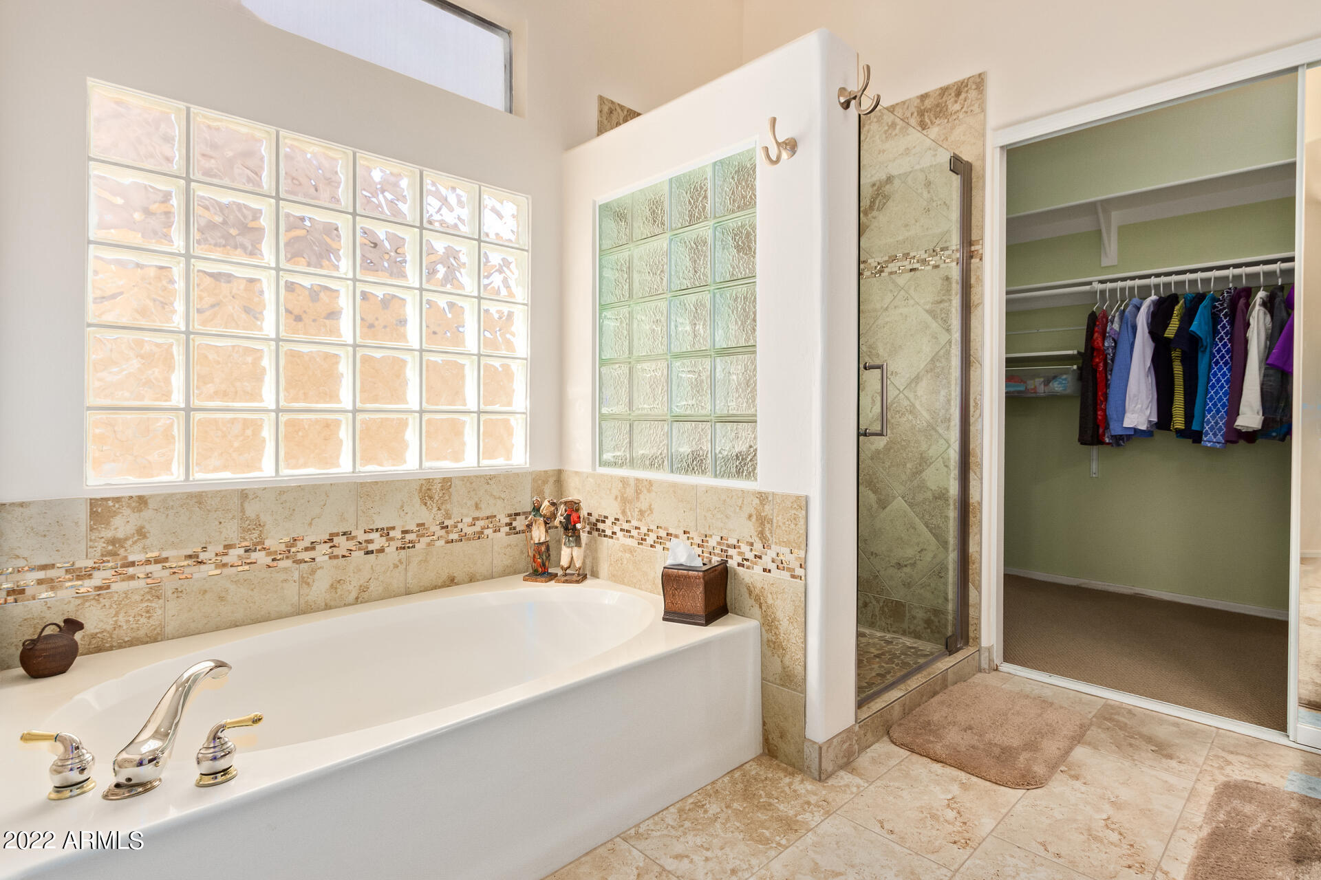 4515 East Jaeger Road Phoenix, AZ 85050 - Photo 15 of 27 a bathroom with a bathtub and a shower