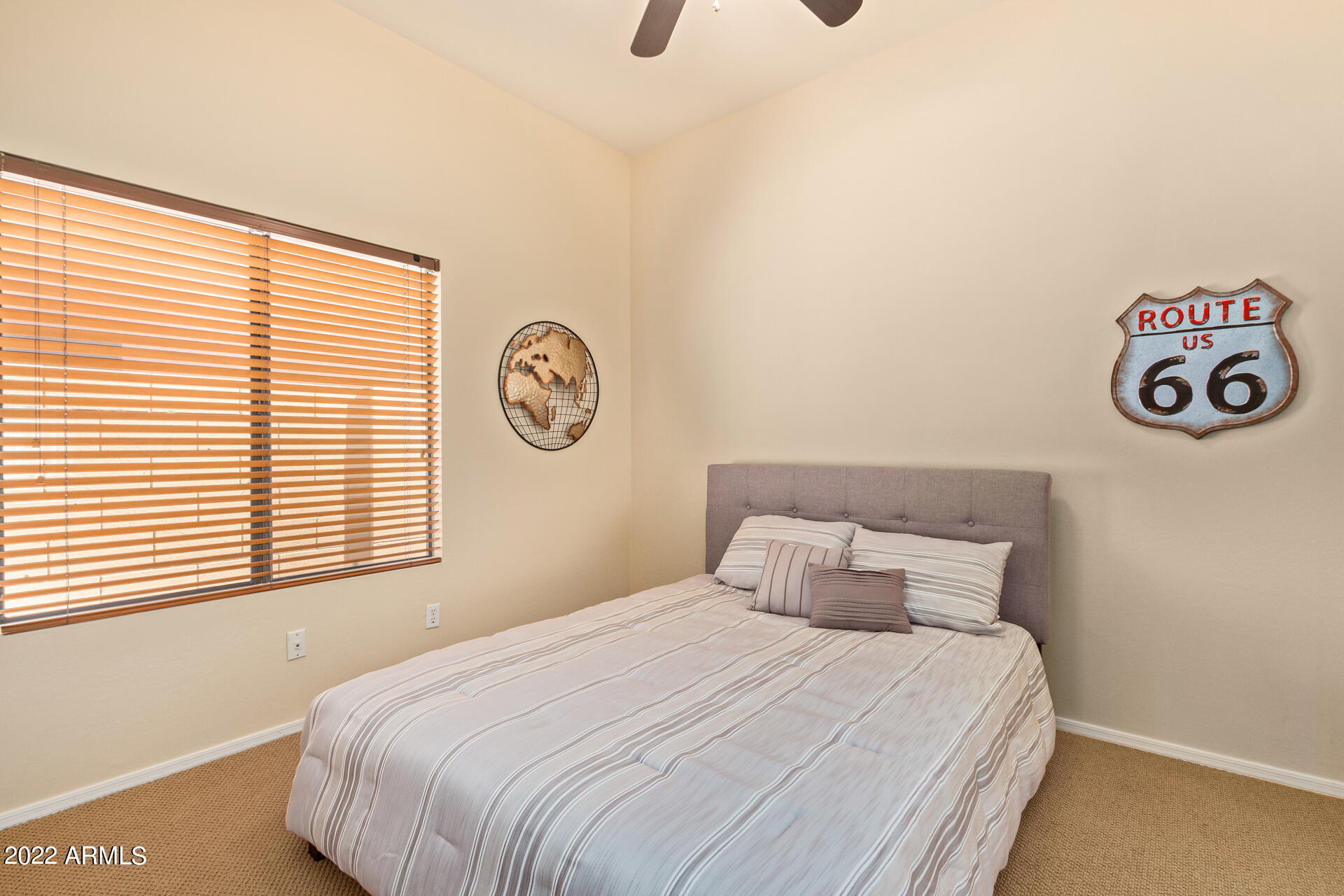 4515 East Jaeger Road Phoenix, AZ 85050 - Photo 17 of 27 a bedroom with a bed and a window
