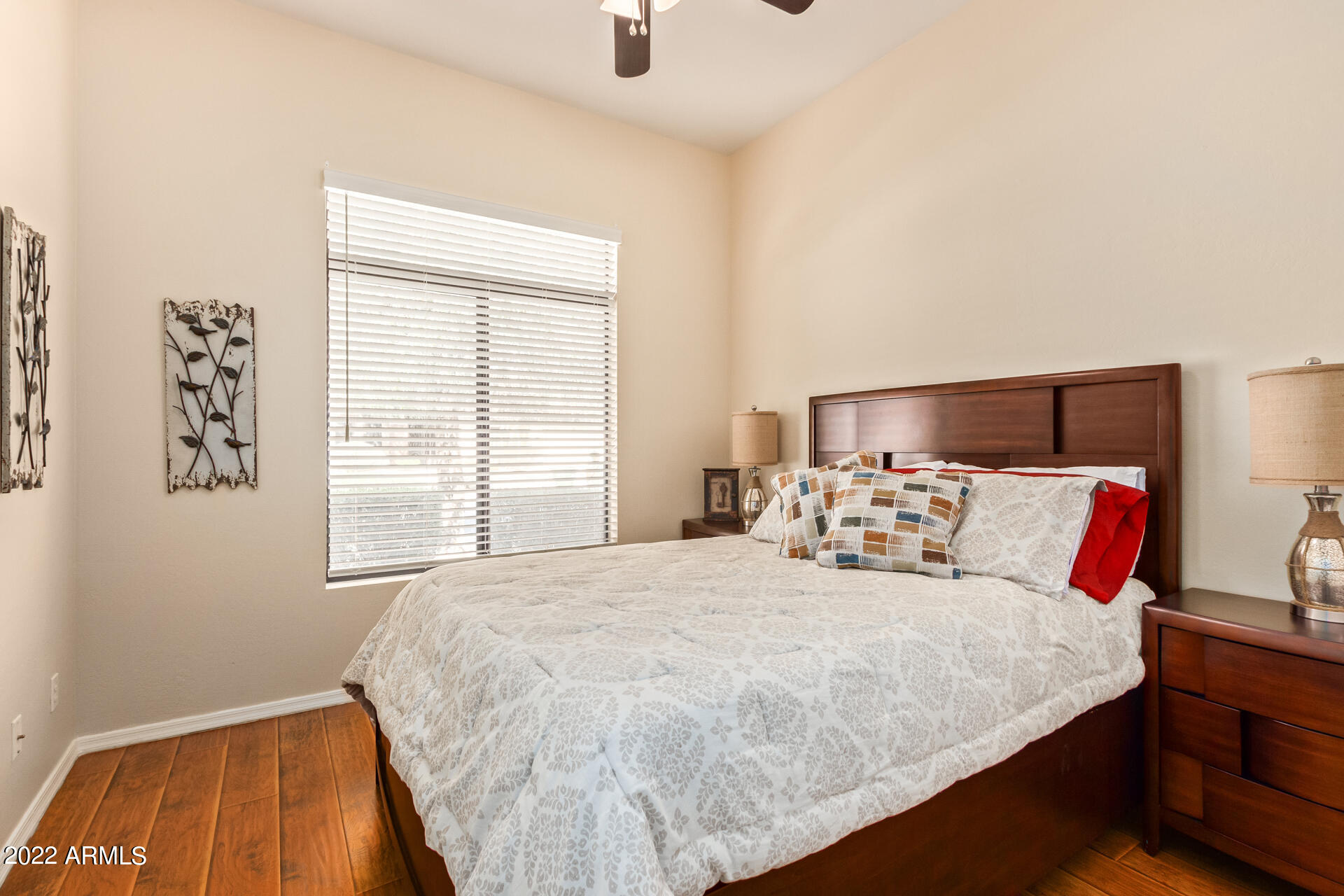 4515 East Jaeger Road Phoenix, AZ 85050 - Photo 19 of 27 a bed sitting in a bedroom next to a window