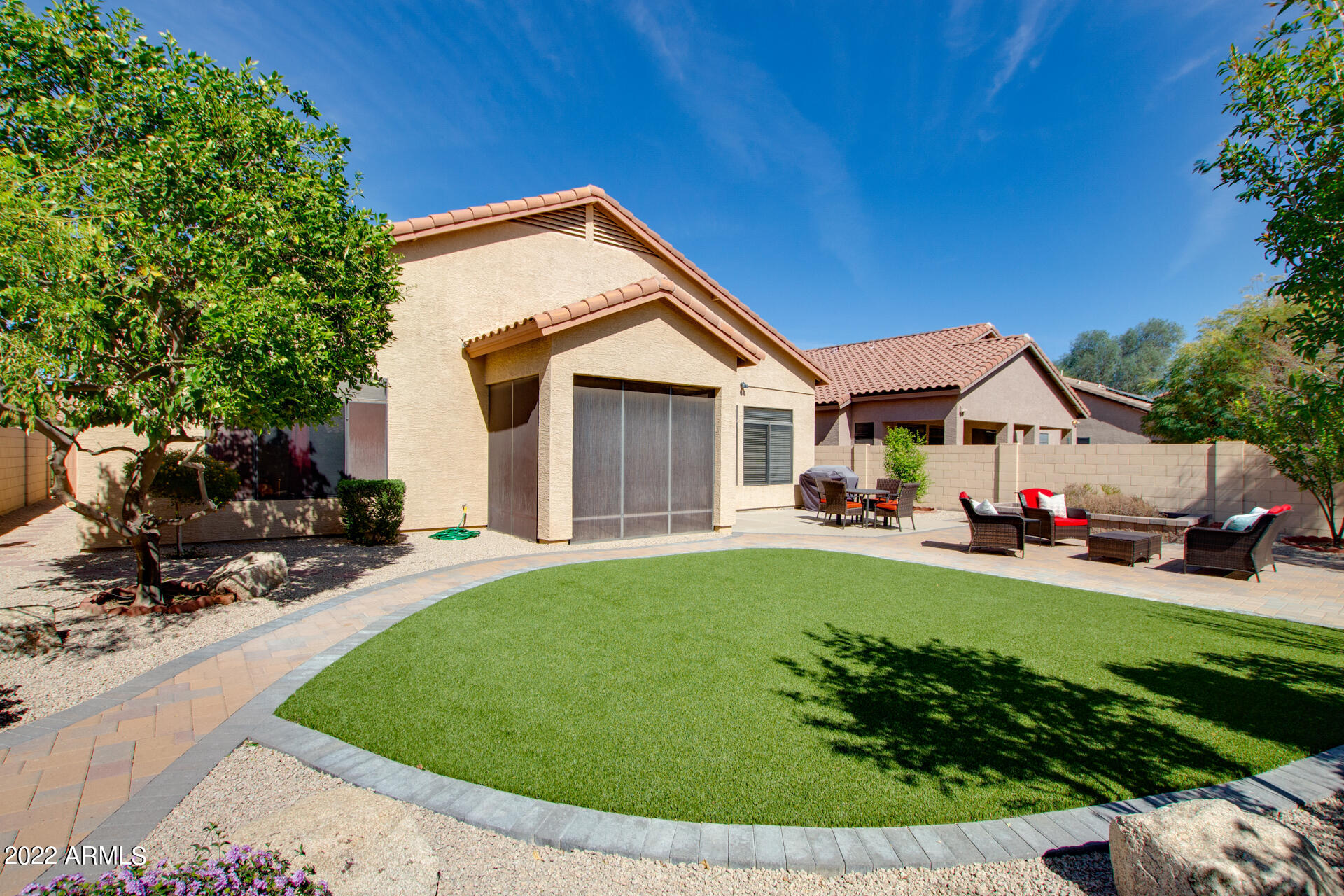 4515 East Jaeger Road Phoenix, AZ 85050 - Photo 2 of 27 a view of a house with backyard sitting area and garden
