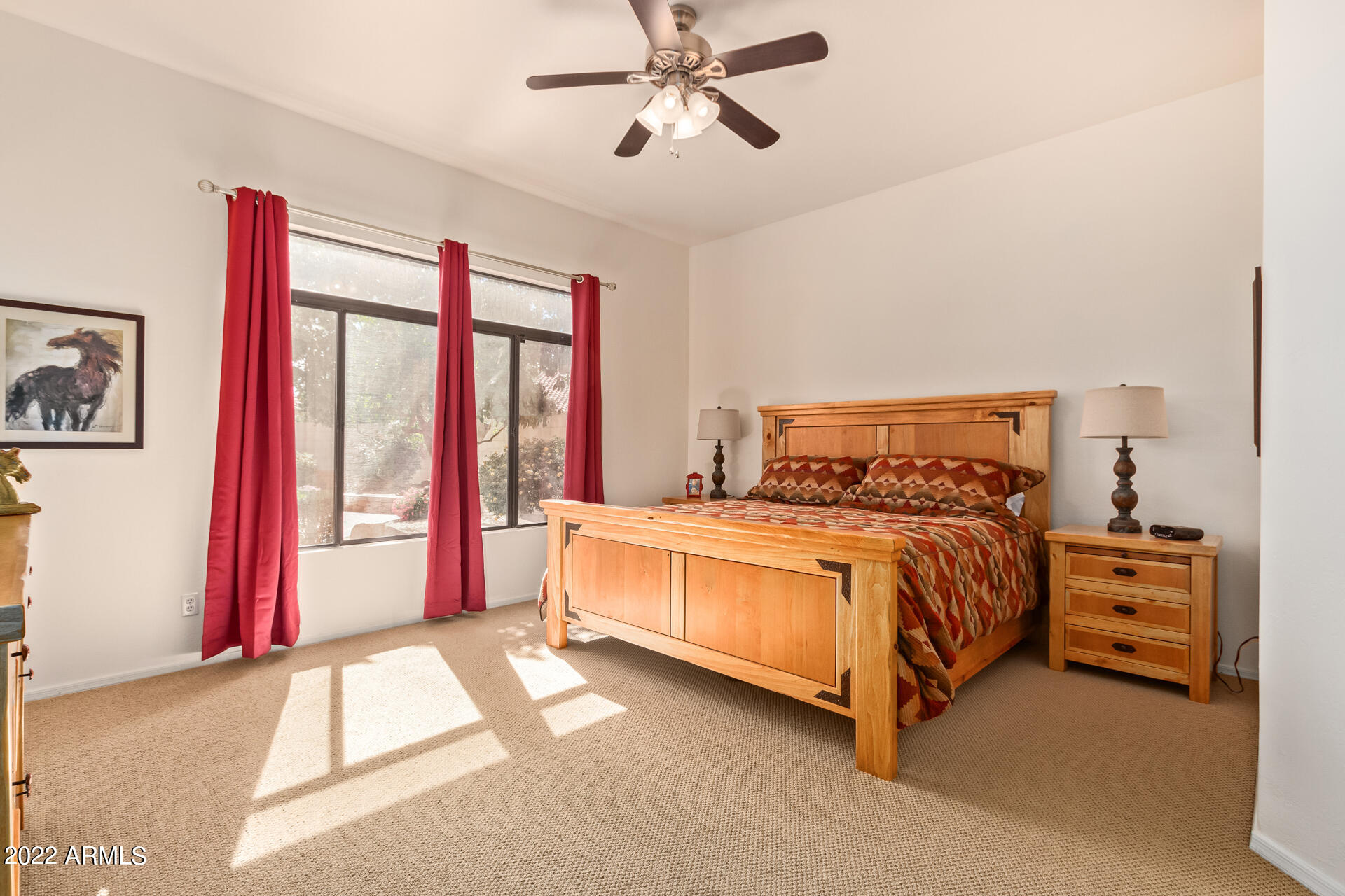 4515 East Jaeger Road Phoenix, AZ 85050 - Photo 4 of 27 a bedroom with a bed and a large window