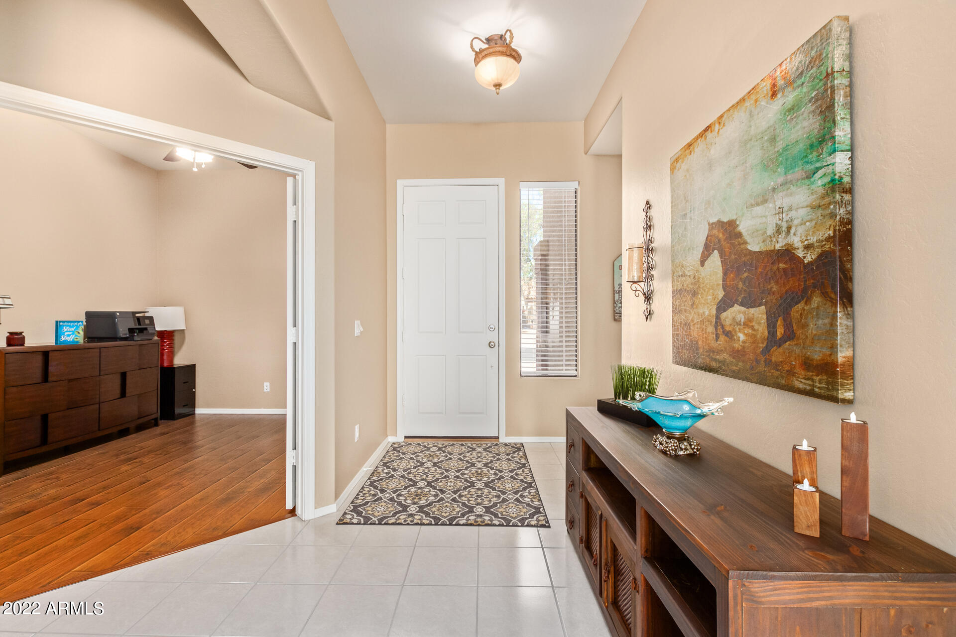 4515 East Jaeger Road Phoenix, AZ 85050 - Photo 9 of 27 a bedroom with a bed dresser and a window