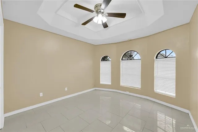 a view of empty room with windows