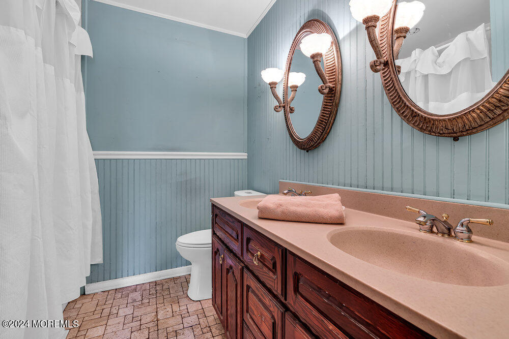 115 Stillwells Corner Road Freehold, NJ 07728 - Photo 23 of 47 a bathroom with a sink and a mirror