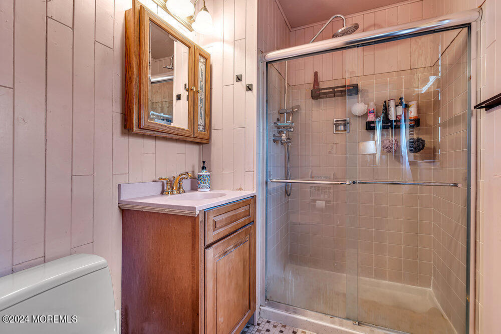 115 Stillwells Corner Road Freehold, NJ 07728 - Photo 28 of 47 a bathroom with a shower and mirror