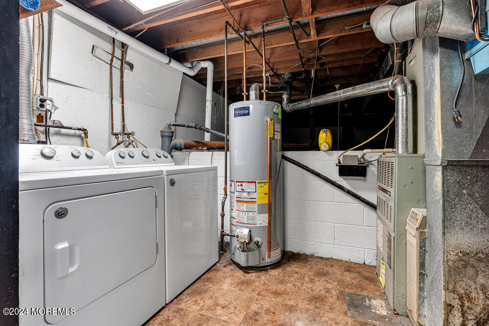 115 Stillwells Corner Road Freehold, NJ 07728 - Photo 31 of 47 a utility room with dryer and washer