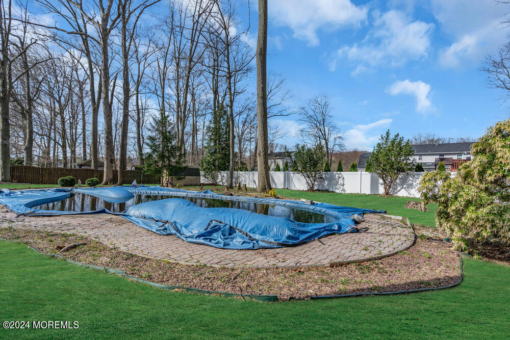 115 Stillwells Corner Road Freehold, NJ 07728 - Photo 35 of 47 a view of a backyard with swimming pool