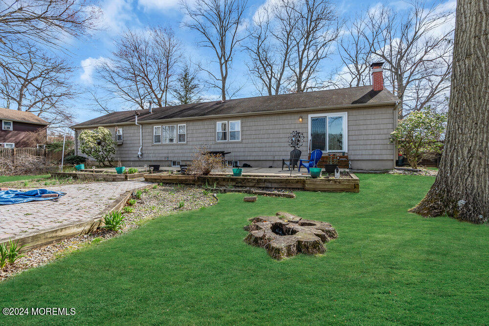 115 Stillwells Corner Road Freehold, NJ 07728 - Photo 36 of 47 a view of a house with backyard and a tree