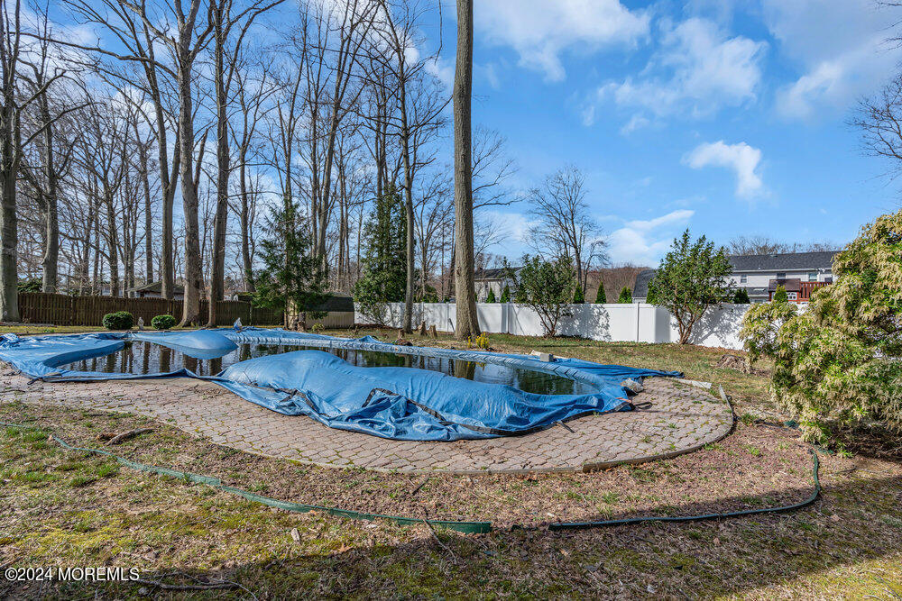 115 Stillwells Corner Road Freehold, NJ 07728 - Photo 40 of 47 a view of a swimming pool with a yard