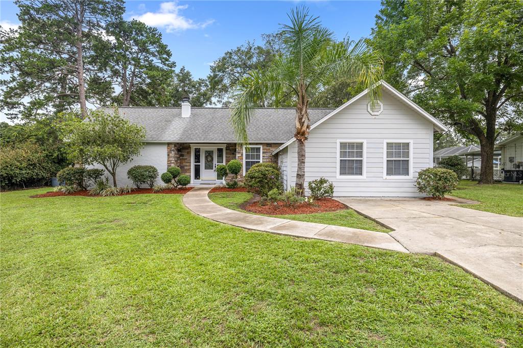 8116 Southwest 100th Street Road Ocala, FL 34481 - Photo 1 of 1 a view of a house with a patio
