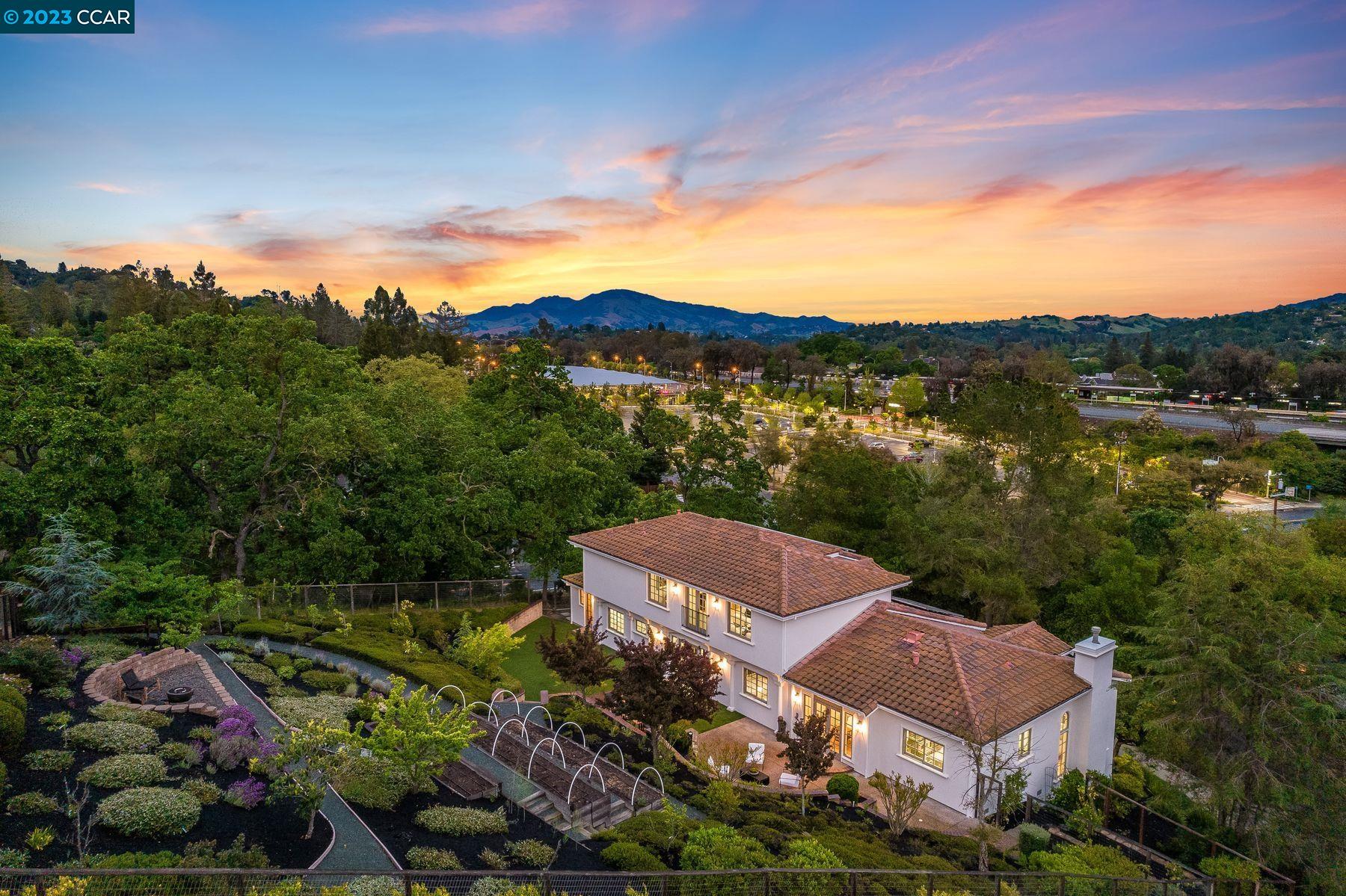 a view of a big house with a big yard