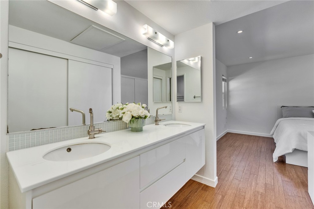 5 Hartford, Unit 36 Irvine, CA 92604 - Photo 14 of 37 a bathroom with a double vanity sink and a mirror