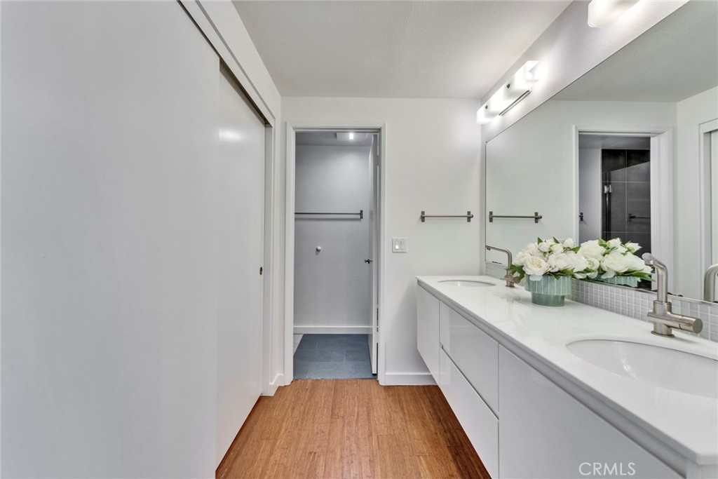 5 Hartford, Unit 36 Irvine, CA 92604 - Photo 15 of 37 a bathroom with a double vanity sink and mirror