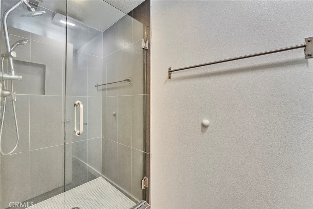 5 Hartford, Unit 36 Irvine, CA 92604 - Photo 16 of 37 a bathroom with a glass shower door