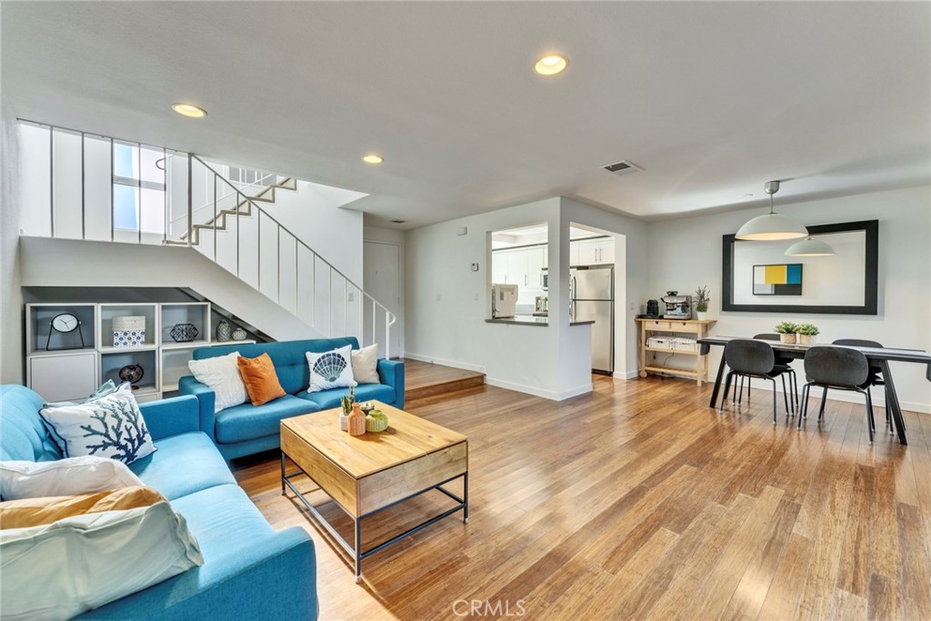 5 Hartford, Unit 36 Irvine, CA 92604 - Photo 2 of 37 a living room with furniture and a wooden floor