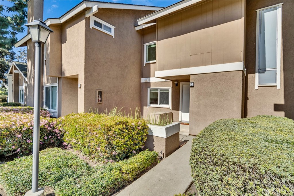 5 Hartford, Unit 36 Irvine, CA 92604 - Photo 22 of 37 a view of a house with a backyard and garden