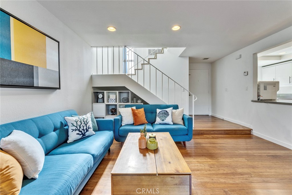 5 Hartford, Unit 36 Irvine, CA 92604 - Photo 3 of 37 a living room with furniture and a wooden floor