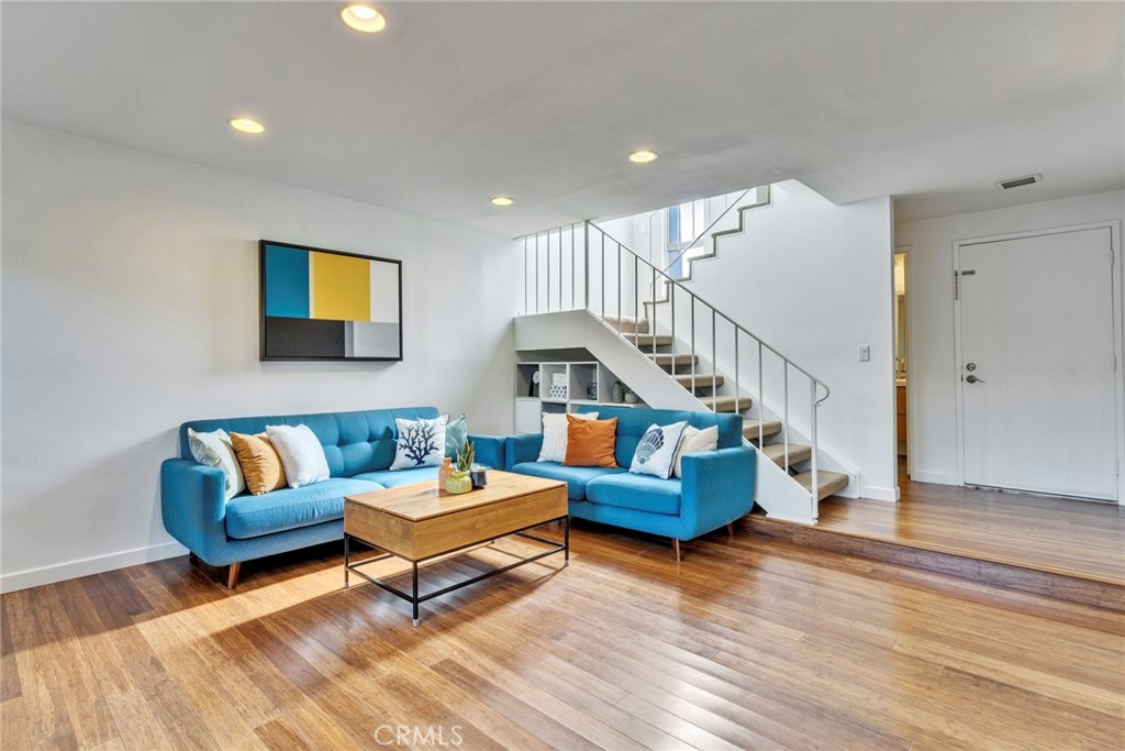 5 Hartford, Unit 36 Irvine, CA 92604 - Photo 4 of 37 a living room with furniture and stairs