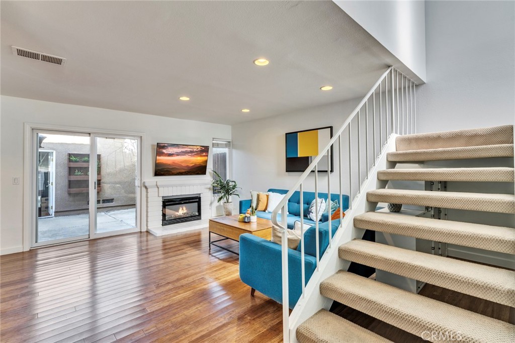 5 Hartford, Unit 36 Irvine, CA 92604 - Photo 5 of 37 a living room with furniture and a flat screen tv