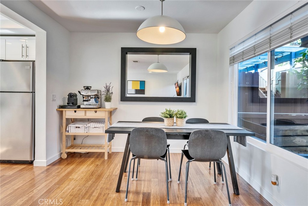 5 Hartford, Unit 36 Irvine, CA 92604 - Photo 6 of 37 a view of a dining room with furniture window and wooden floor