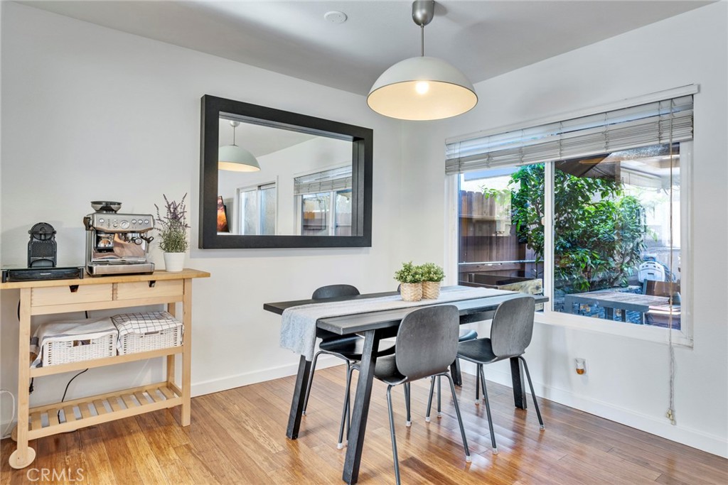 5 Hartford, Unit 36 Irvine, CA 92604 - Photo 7 of 37 a view of a dining room with furniture window and wooden floor