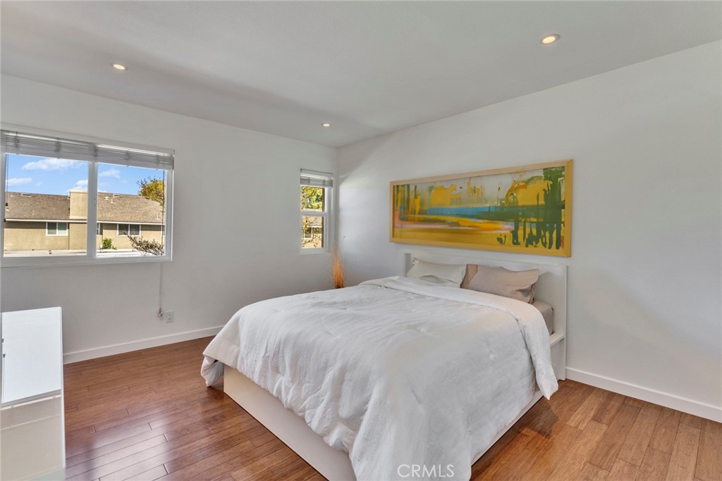 5 Hartford, Unit 36 Irvine, CA 92604 - Photo 10 of 37 a bedroom with a bed and wooden floor