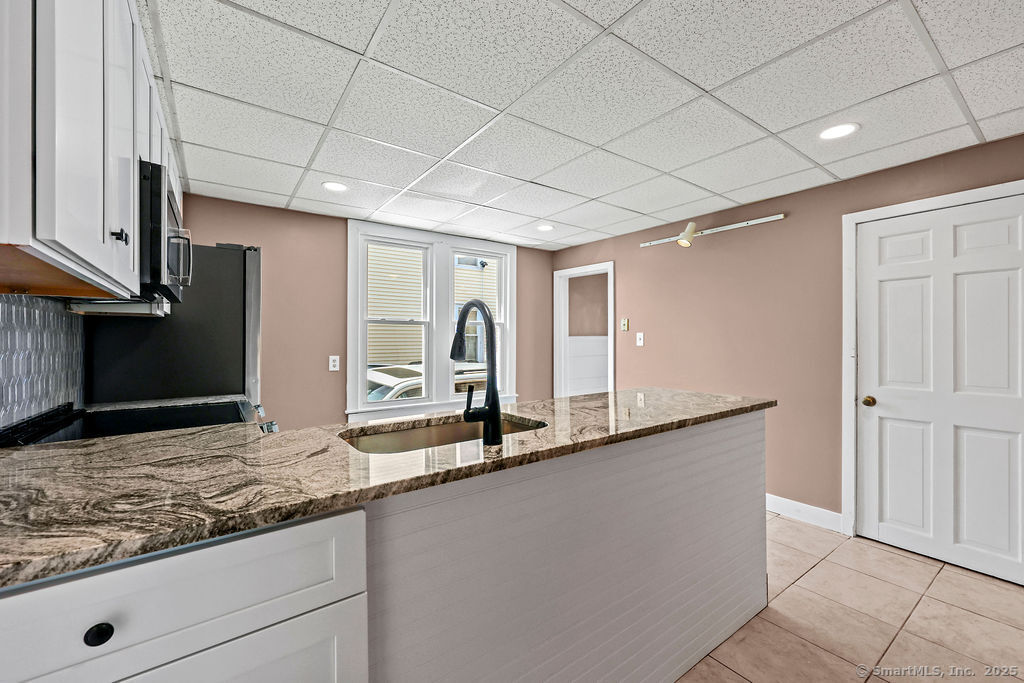 10 Silver Street Middletown, CT 06457 - Photo 11 of 20 a kitchen with stainless steel appliances granite countertop a sink and a granite counter tops