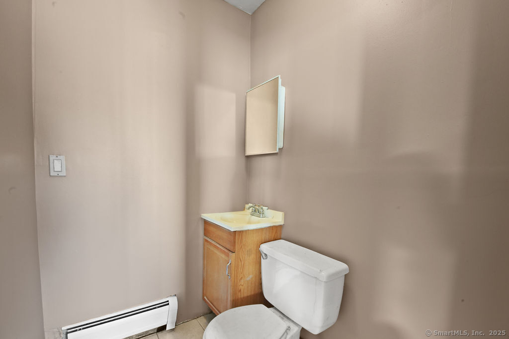 10 Silver Street Middletown, CT 06457 - Photo 15 of 20 a white toilet sitting next to a bathroom sink