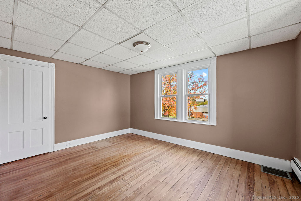 10 Silver Street Middletown, CT 06457 - Photo 17 of 20 a view of an empty room with wooden floor and a window