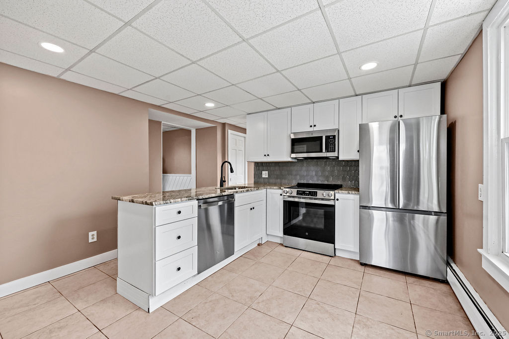 10 Silver Street Middletown, CT 06457 - Photo 9 of 20 a kitchen with stainless steel appliances granite countertop a refrigerator stove and sink