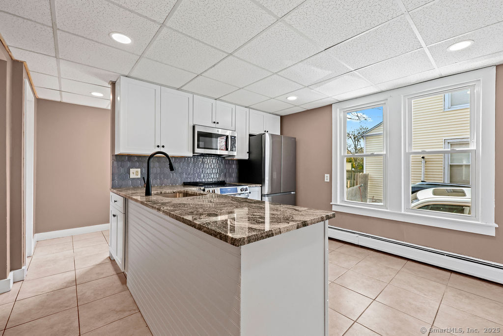 10 Silver Street Middletown, CT 06457 - Photo 10 of 20 a kitchen with stainless steel appliances granite countertop a sink stove and refrigerator