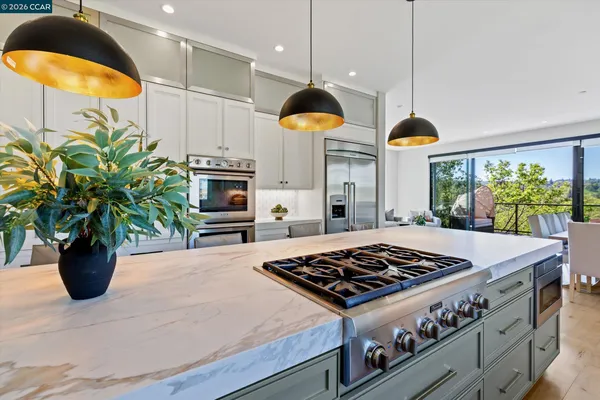 a kitchen with cabinets and appliances